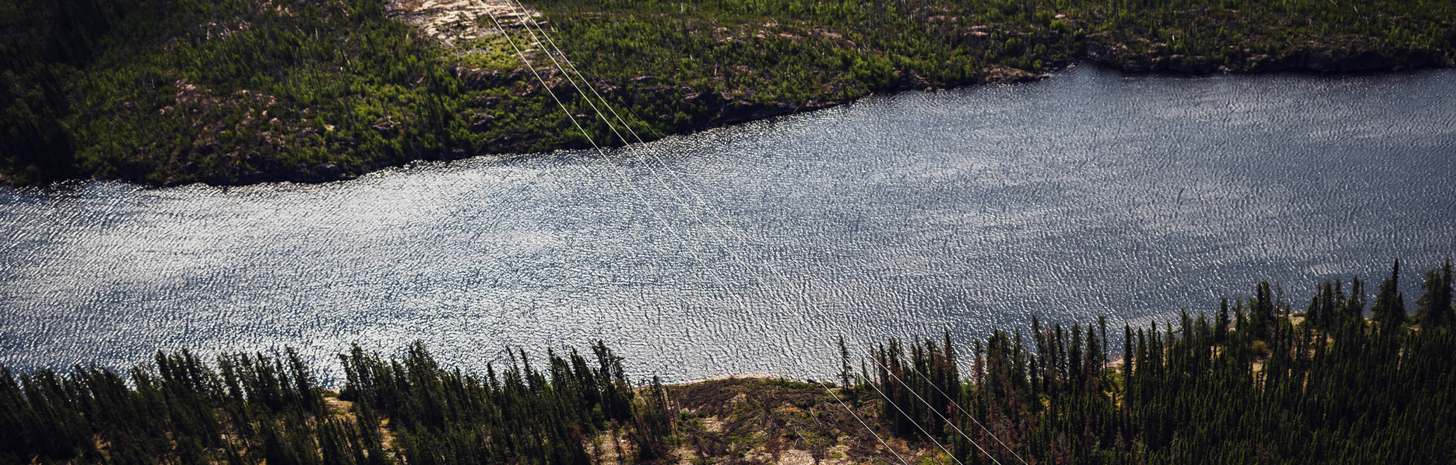 Reporting_HeaderIMG Power lines over a river